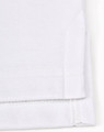 A white sustainable poly/cotton polo shirt with a folded sleeve, showcasing the fabric texture and stitching details.
