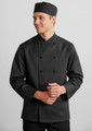 A black long sleeve chef jacket with a buttoned front and a matching chef hat. The model is smiling.