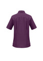 A short-sleeved purple overblouse with a collar and subtle seam detailing, featuring a logo.
