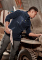 A man in a navy lightweight 1/4 zip polar fleece, working on a vehicle, with a logo on the garment.