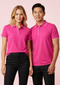 A pink short sleeve polo shirt for men, featuring a contrasting collar and logos.