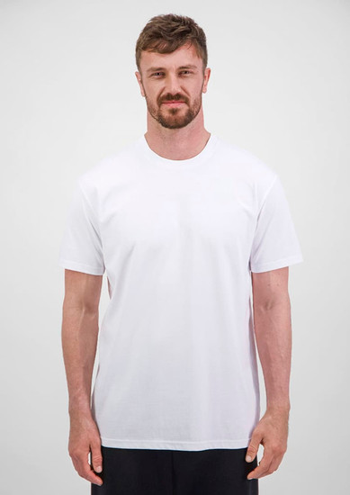 A man wearing a plain white short sleeve tee, standing against a neutral background. The tee features a logo.
