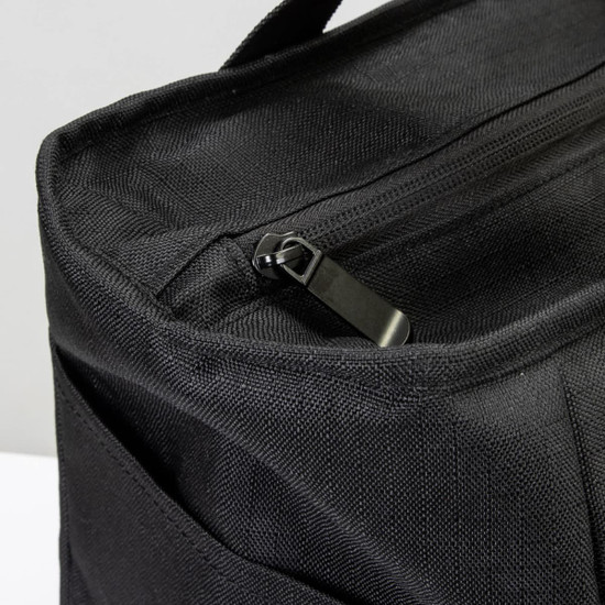 A black cooler bag with a zip closure and textured fabric, featuring an exterior pocket.