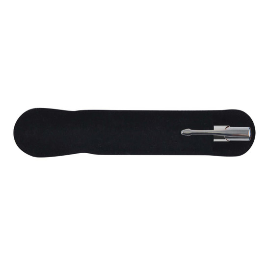 A silver metal pen rests on a black velvet holder, showcasing its sleek design.