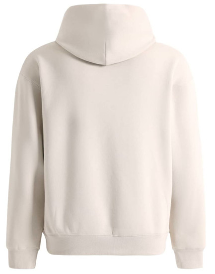 A unisex premium fleece oversized hoodie in a soft cream colour, featuring a large hood and a relaxed fit.