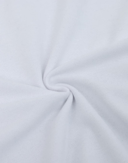 A close-up of white fabric featuring a smooth cotton/poly blend texture, with a slight sheen and circular pattern.