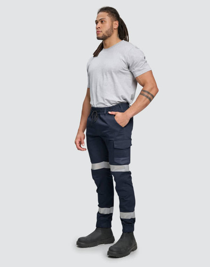 Cotton stretch drill cuffed work pants in navy blue with reflective tape details, worn by a standing male model.
