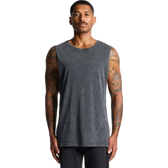 A man wearing a stone wash grey tank top with a round neckline and tattoos visible on his arms.