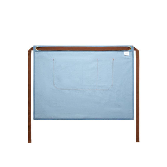A denim half apron in blue with brown ties and a pocket, featuring a logo on the corner.