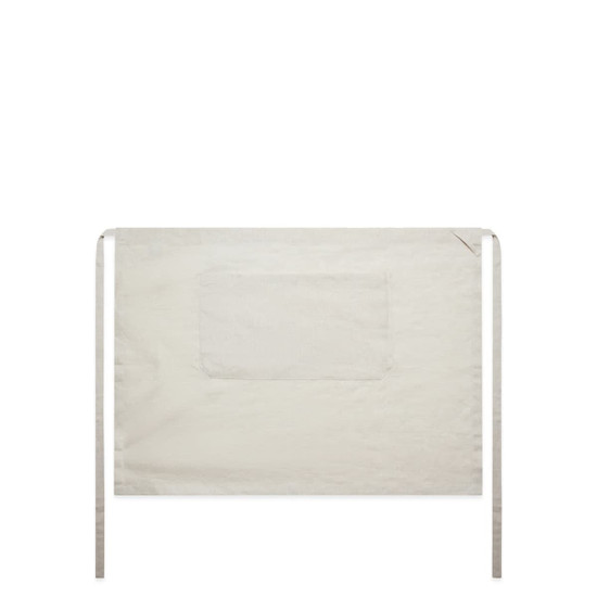 A plain linen half apron in a light beige colour with a front pocket and ties. Features a logo.