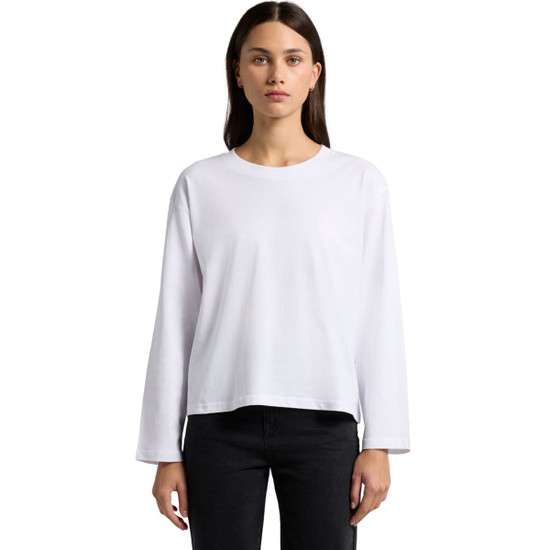 A long-sleeve white t-shirt with a relaxed fit displayed on a model against a plain background.