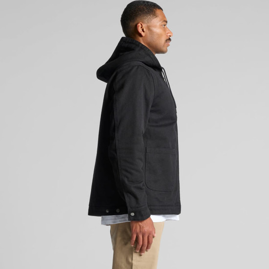 A black canvas heavy hooded jacket featuring a front pocket and a logo. Displayed on a model in profile view.