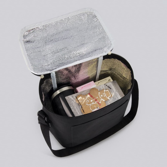A black cooler bag with a silver interior, containing wrapped gifts and a drink bottle.