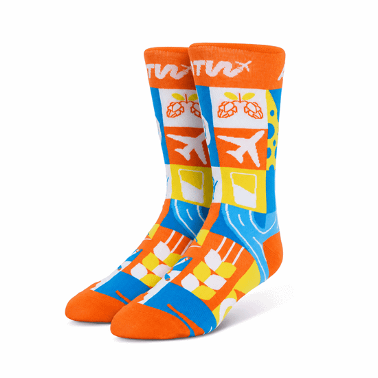 Brightly coloured custom bamboo socks in orange, blue, and yellow featuring various playful patterns and designs.