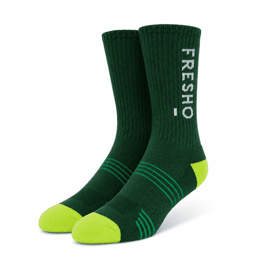 Custom athletic socks in green with lime green accents and a logo on the side.