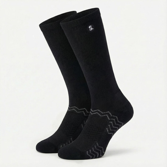 A pair of black equestrian socks featuring a subtle logo and a textured design at the base.