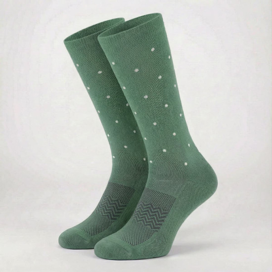A pair of green equestrian socks featuring a dotted pattern and a textured design on the ankle area.