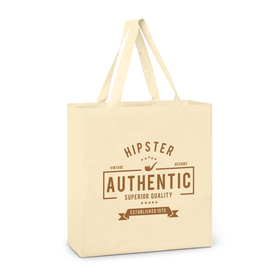 A cream cotton tote bag with two handles, featuring a logo and branding elements in brown.