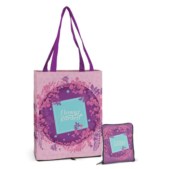 A pink tote bag with floral designs and a matching pouch in a purple and pink colour scheme. It has a logo.