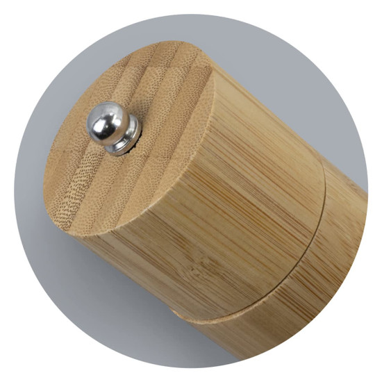 A bamboo pepper mill featuring a round wooden body and a metal top knob. The design is natural and sleek.