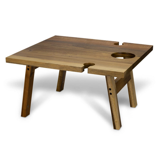 A square wooden folding table with a natural finish, featuring a hole for a drink, set on sturdy legs.