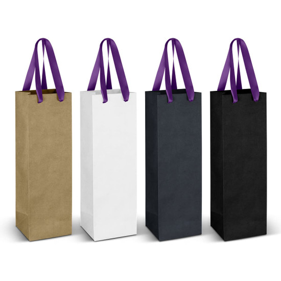 A collection of four paper bags in gold, white, black, and dark green, each with a purple ribbon handle.