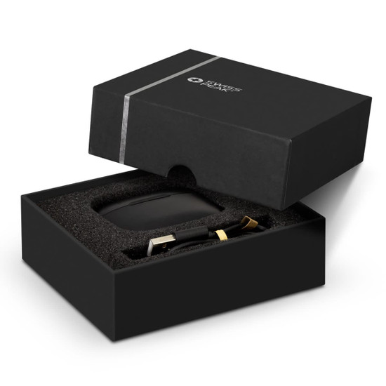 A black box containing Swiss Peak ANC TWS earbuds, with gold accents and a soft inner lining.