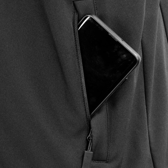 A close-up of a black vest pocket featuring a smartphone, highlighting its zipper detail.