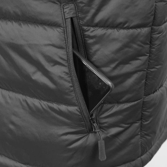 A close-up of a black puffer vest pocket with a phone partially visible inside. The vest features a zipper.