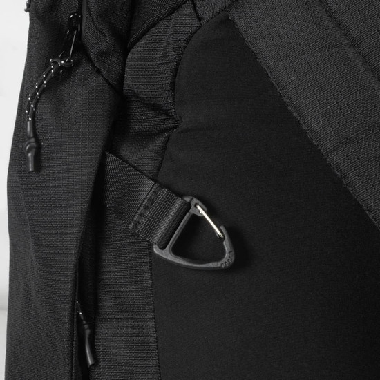 A black backpack featuring side straps and a sturdy clip. It has a sleek, modern design.