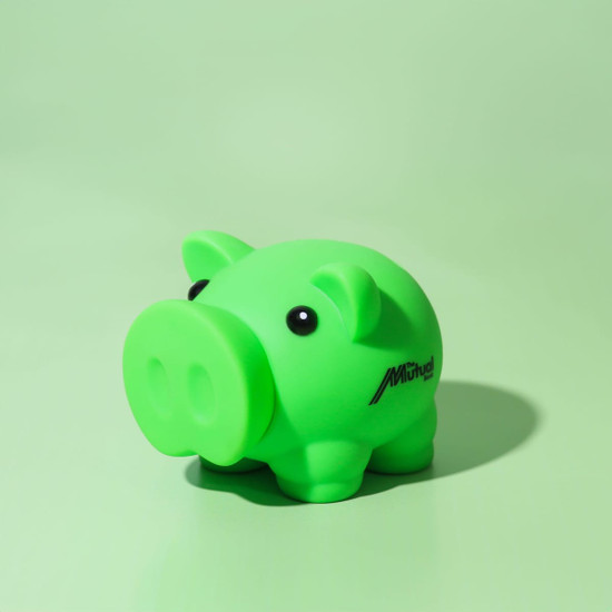 A green pig-shaped money box with black eyes and a logo on its side, set against a mint green background.