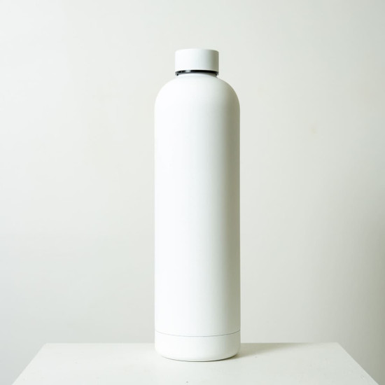A drink bottle in sleek white, with a cylindrical design and a cap, featuring a subtle logo.