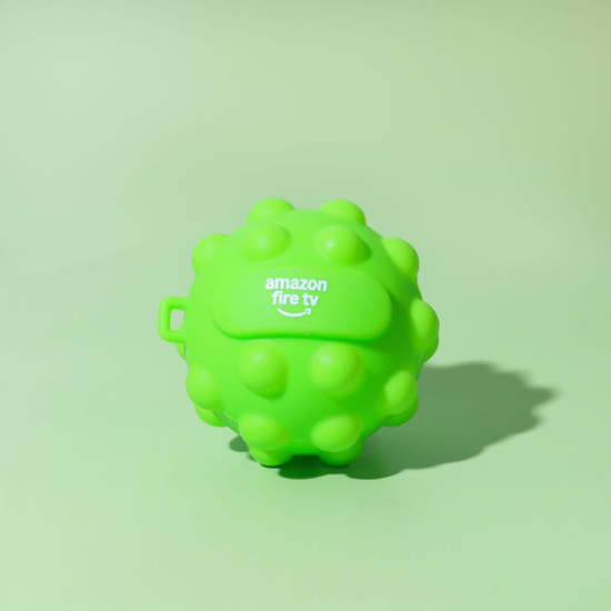 A bright green, textured stress ball with a logo, featuring a round, spiky design.