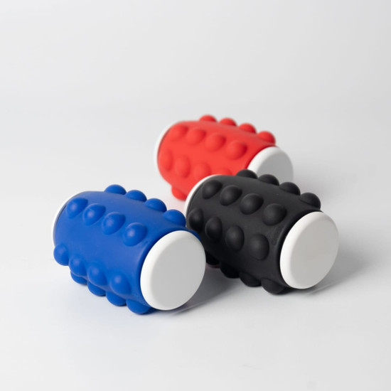 A set of three Whirl Popper Spinners in red, black, and blue with white ends and a textured surface.