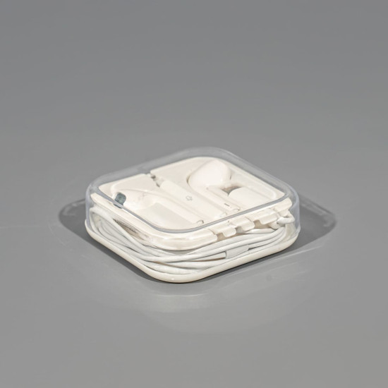 A set of white USB Type C earphones, neatly packaged in a transparent case.