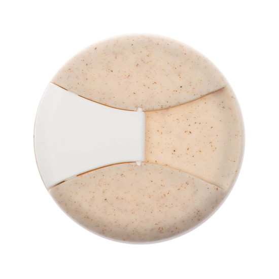 A reusable coffee cup in a beige color featuring a silicone band and a sleek design. It also has a logo.