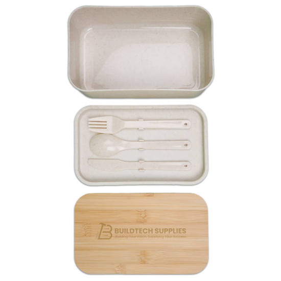A bamboo lunch box with a clear lid and a removable compartment containing a spoon, fork, and knife.
