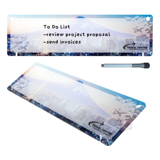 A dry erase board featuring a blue and white design with a mountain and city skyline, along with a marker.
