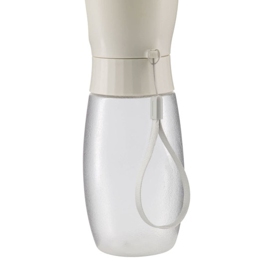 A drink bottle with a clear base and a cream-coloured top, featuring a loop for easy carrying.