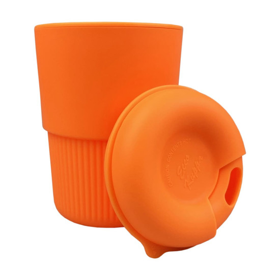 A reusable coffee cup in bright orange silicone with a matching lid, featuring a ribbed texture and a logo.