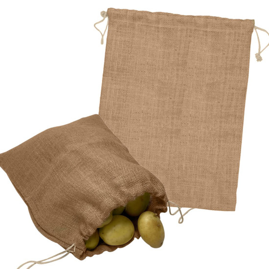 A jute bag in a natural brown colour, featuring a drawstring closure, with some potatoes inside.