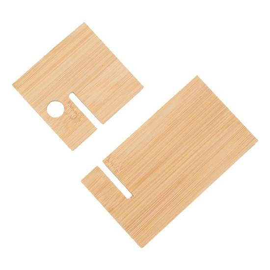 A bamboo phone holder in light brown, featuring two pieces with cut-outs for device support and cable management.