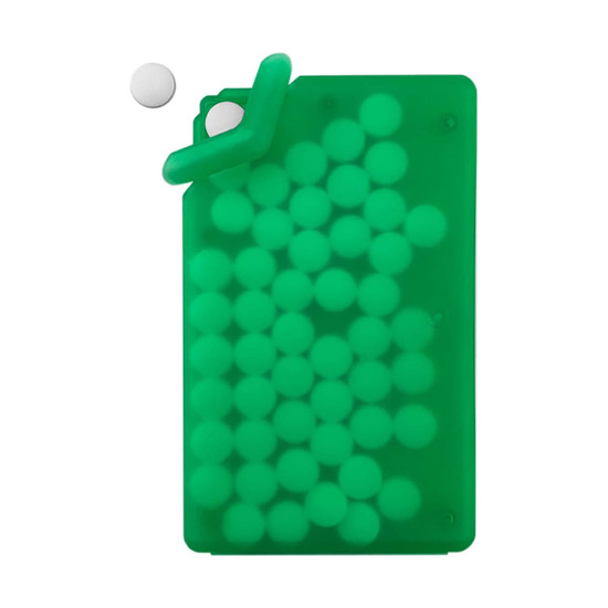 A green silicone card holder filled with white sugar-free mint tablets, with one tablet positioned above the holder.