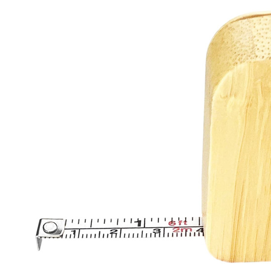 A bamboo tape measure key ring in natural brown, with a visible retractable tape marked in centimetres.