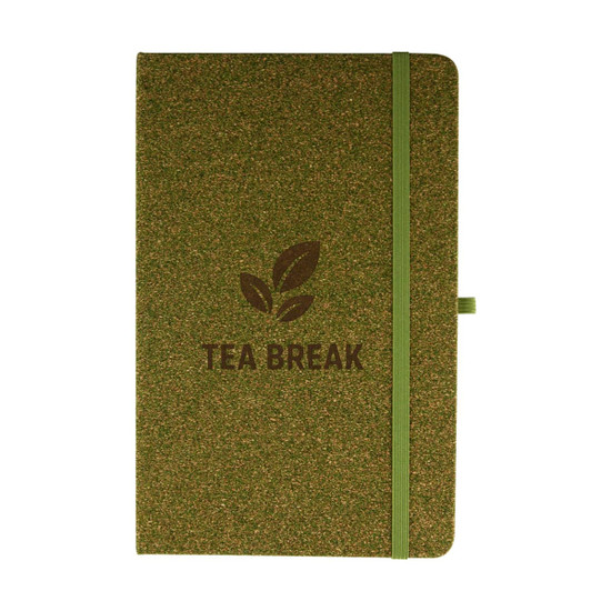 A green cork notebook with a matching elastic band and a logo featuring tea leaves.