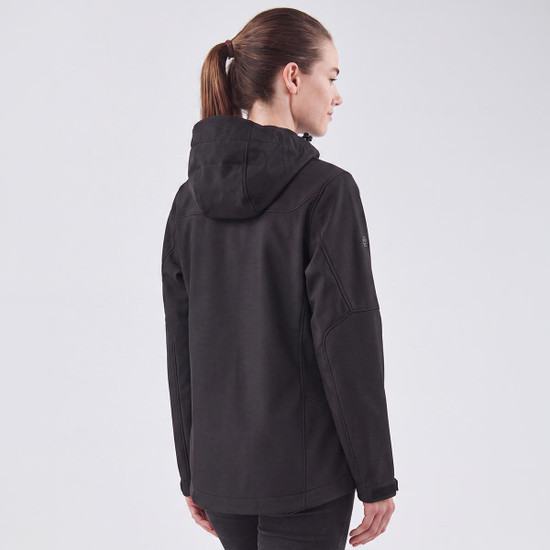 A black women's softshell jacket with a hood, displayed from the back. It features a logo on the sleeve.