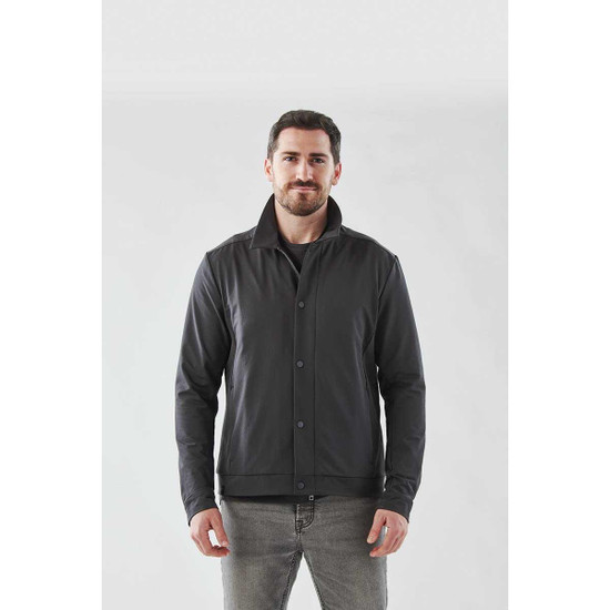 A man wearing a black Men's Soho Jacket, front view, against a plain background. The jacket has a logo on it.
