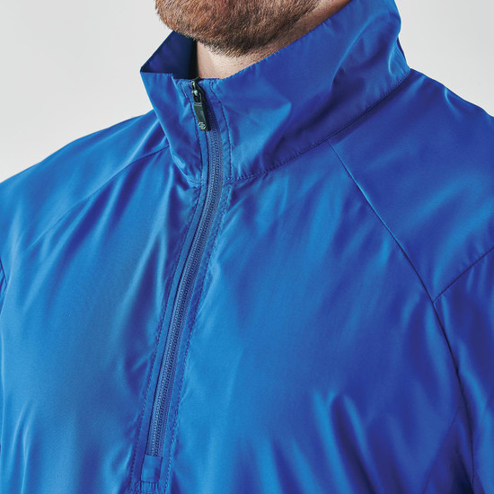 A blue men's 1/4 zip anorak jacket with a high collar and a zipper, featuring a logo on the front.