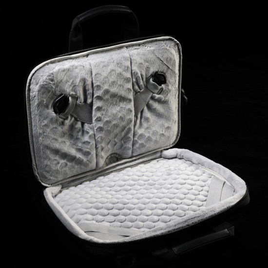 A grey laptop sleeve featuring a soft, padded interior and adjustable straps for securing a device.