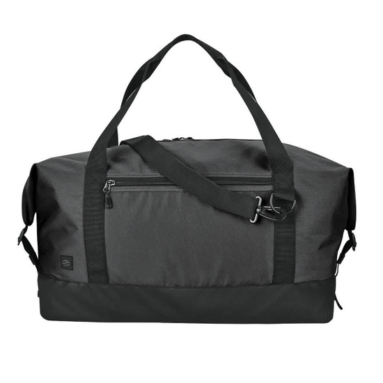 A black duffle bag with dual handles, a detachable shoulder strap, and a zippered front pocket. Features a logo.